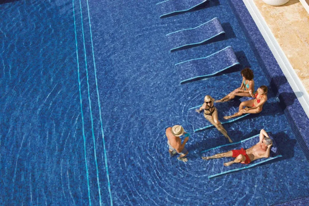 Breathless Punta Cana aerial view of friends at pool